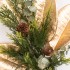 Decorative Branch with Green Needles and Pine Cones